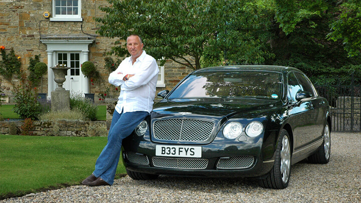 Ian Botham with number plate B33 FYS