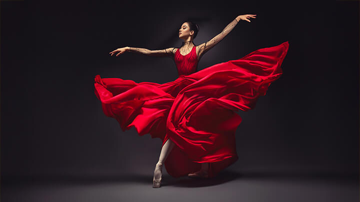 An elegant dancer in a red dress